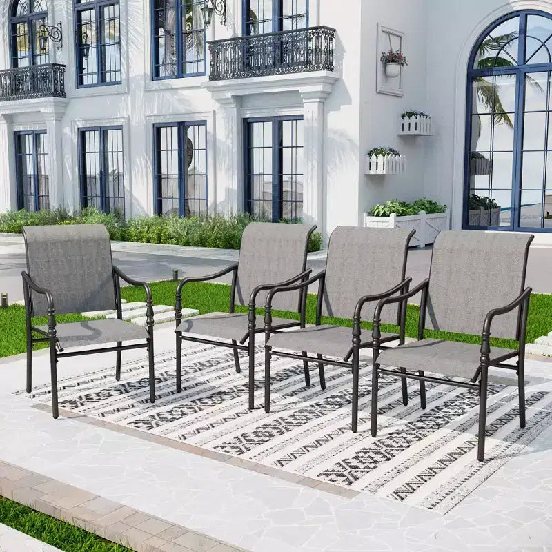 Captiva Designs Tavolo rettangolare spazioso da 9 pezzi con piano a doghe in metallo e foro per ombrellone e sedie fisse in acciaio con braccioli a zucca