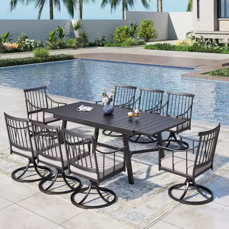 Set da pranzo da patio Captiva Designs, 9 pezzi, con tavolo rettangolare regolabile in acciaio con piano a doghe e poltroncine eleganti con cuscini