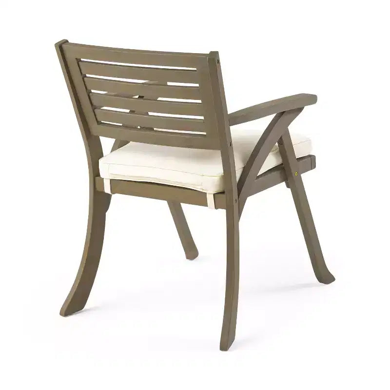 Set da pranzo Zhana per esterni in legno di acacia a 7 pezzi con cuscino di GDFStudio