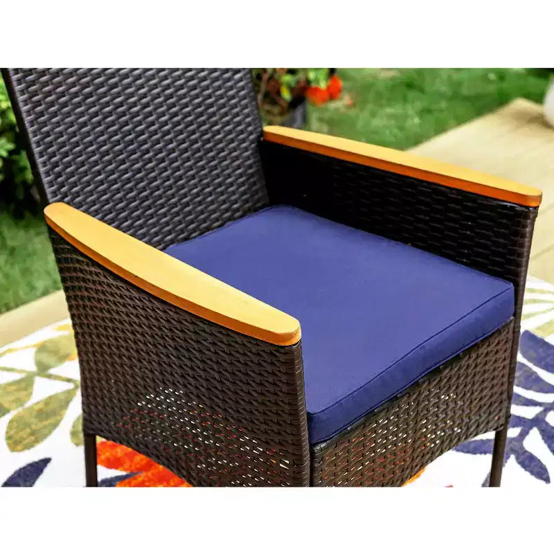 Captiva Designs Set da pranzo da 7 pezzi per patio con tavolo in legno di acacia con finitura a olio e sedie in rattan