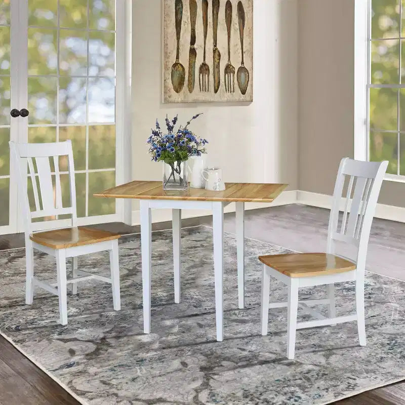 Tavolo da pranzo piccolo con due prolunghe a ribalta International Concepts con 2 sedie San Remo Splat